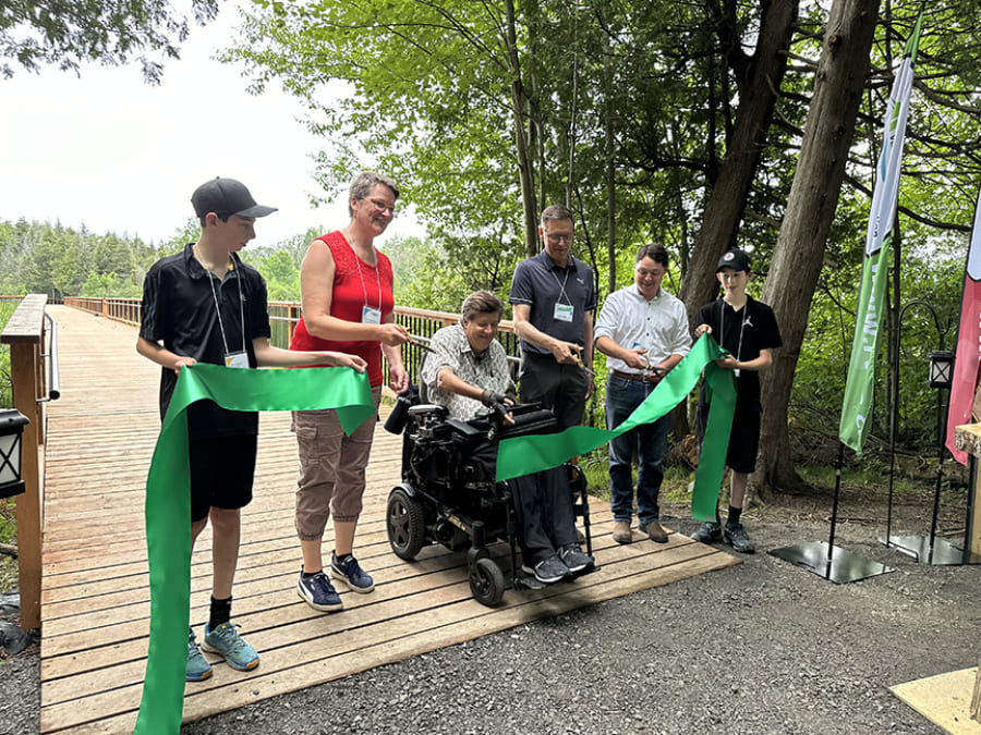 ribbon cutting at new accessible bridge